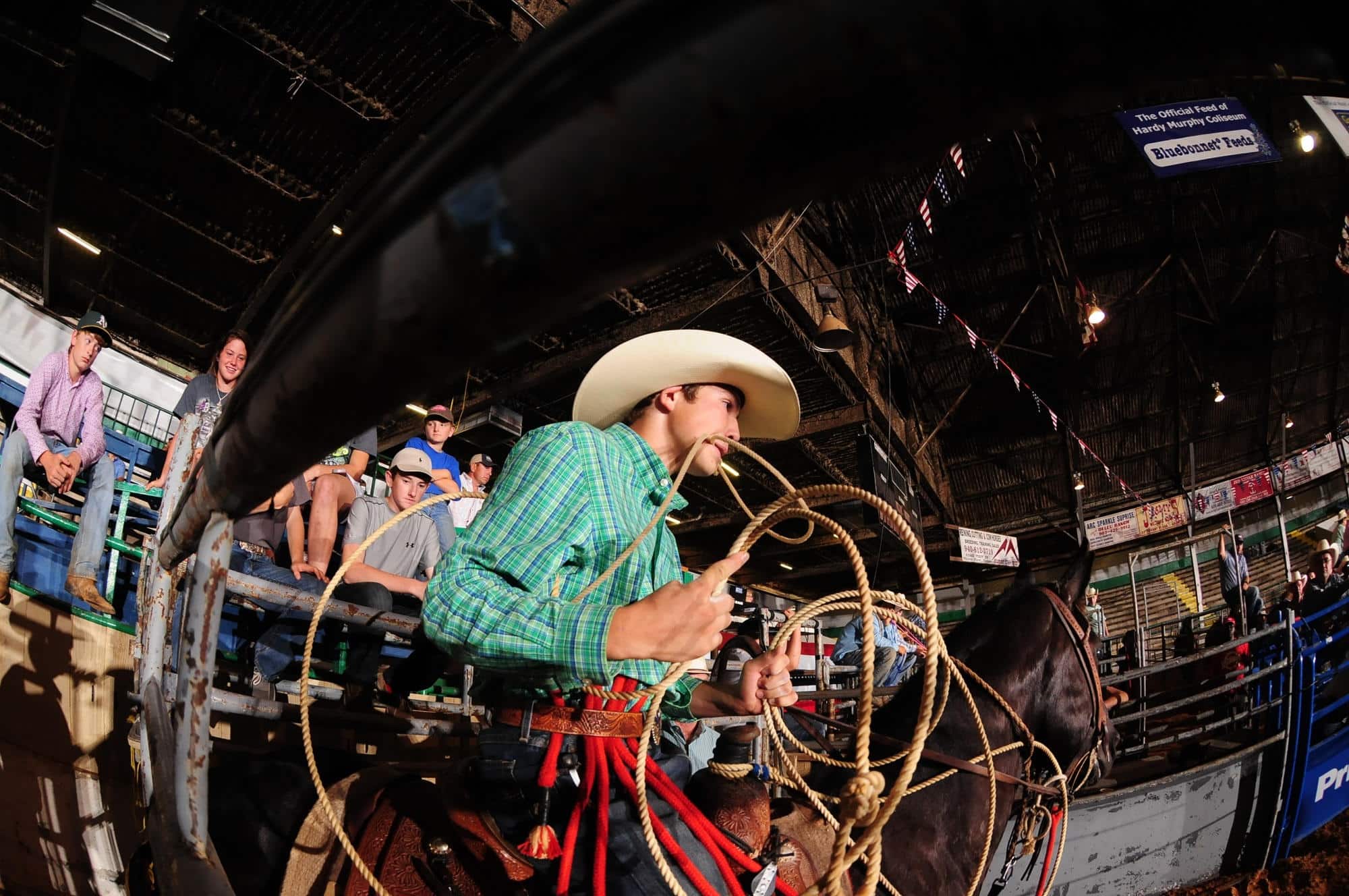 A calf roping competition inside Hardy Murphy Coliseum