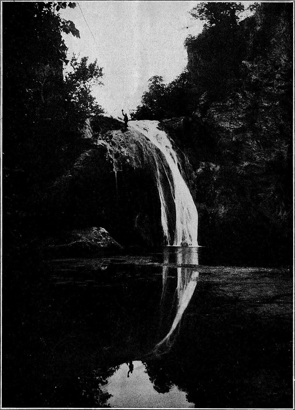 Historic 1909 photograph of Turner Falls reflected in the pool below