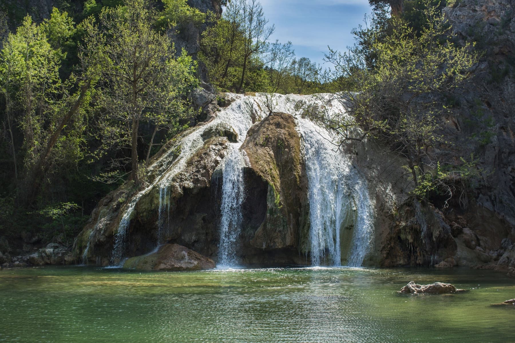 Turner Falls cascading into the natural swimming pool below